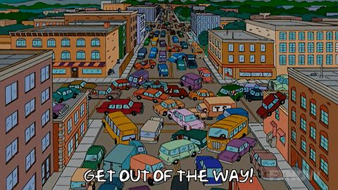 An Aerial View Of A Busy City Street With The Words Get Out Of The Way On The Bottom GIF