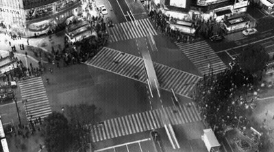 An Aerial View Of A Busy Intersection With A Building That Says Sutaya On It GIF
