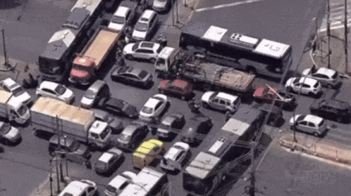 An Aerial View Of A Busy Intersection With A Bus That Has The Number 43 On The Side GIF