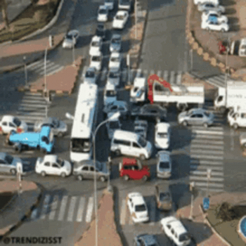 An Aerial View Of A Busy Intersection With The Words Trendizisst On The Bottom Right GIF