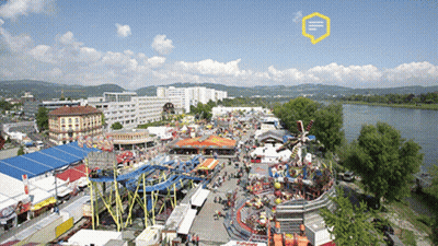 An Aerial View Of A Carnival With A Yellow Speech Bubble That Says ' E ' On It GIF
