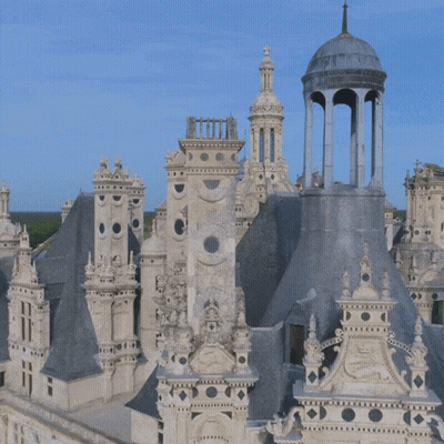 An Aerial View Of A Castle With A Tower That Looks Like A Clock Tower GIF