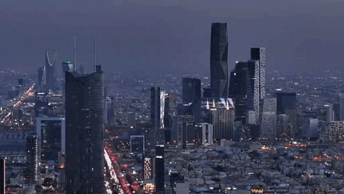 An Aerial View Of A City At Night With A Few Buildings That Say ' Www ' On Them GIF