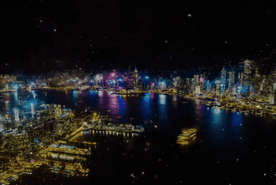 An Aerial View Of A City At Night With A Lot Of Lights GIF