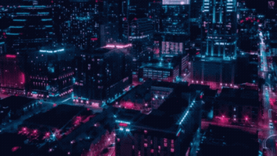 An Aerial View Of A City At Night With A Sign That Says ' City Square ' On It GIF