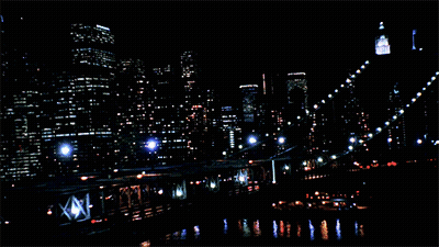 An Aerial View Of A City At Night With A Sign That Says ' Empire ' On It GIF