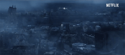 An Aerial View Of A City At Night With Netflix Written In The Corner GIF