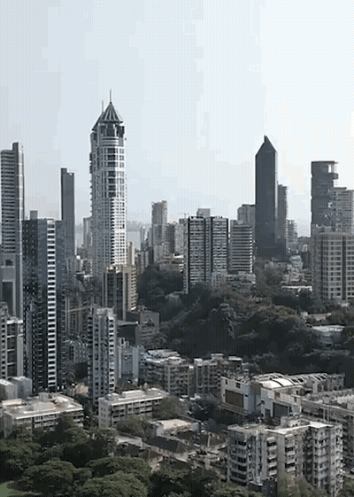 An Aerial View Of A City Skyline With Lots Of Tall Buildings GIF