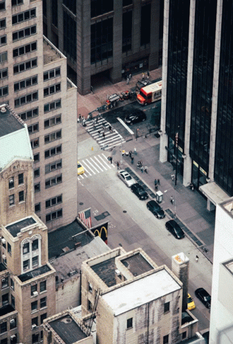 An Aerial View Of A City Street With A Mcdonald 'S In The Middle Of It GIF