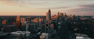 An Aerial View Of A City With A Bet Logo On The Bottom Right GIF