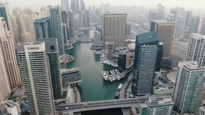 An Aerial View Of A City With A Building That Has The Word Emaar On It GIF