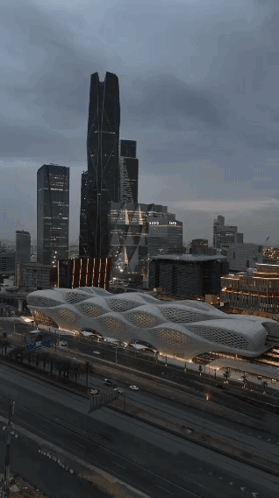 An Aerial View Of A City With A Large Building That Says Expo On It GIF