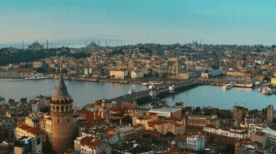 An Aerial View Of A City With A Large Tower In The Middle GIF
