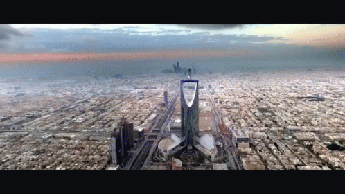 An Aerial View Of A City With A Tower In The Middle GIF