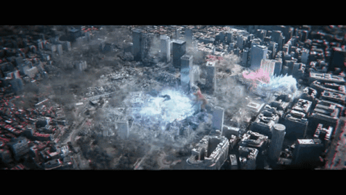 An Aerial View Of A City With Buildings And Smoke GIF