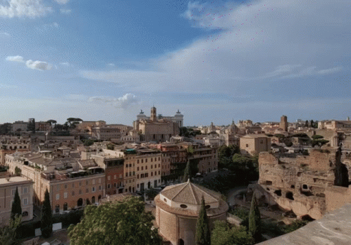 An Aerial View Of A City With Buildings And Trees GIF