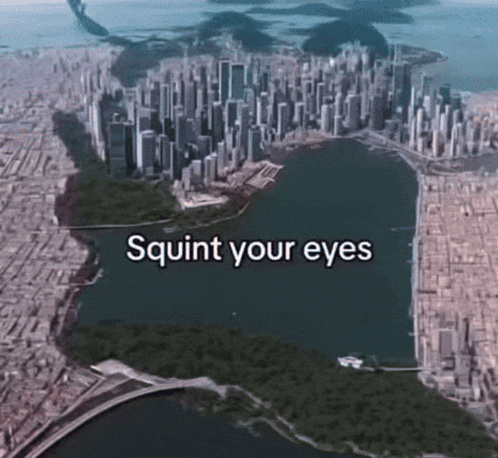 An Aerial View Of A City With The Words Squirt Your Eyes GIF