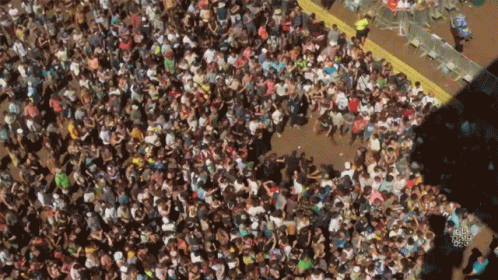 An Aerial View Of A Crowd Of People With A Yellow Line Going Through The Middle GIF