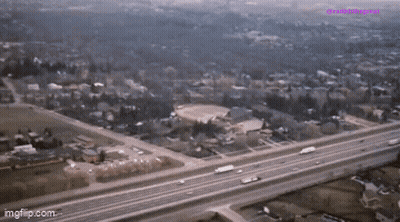 An Aerial View Of A Highway Going Through A Residential Area With The Words Imgflip.com At The Bottom GIF