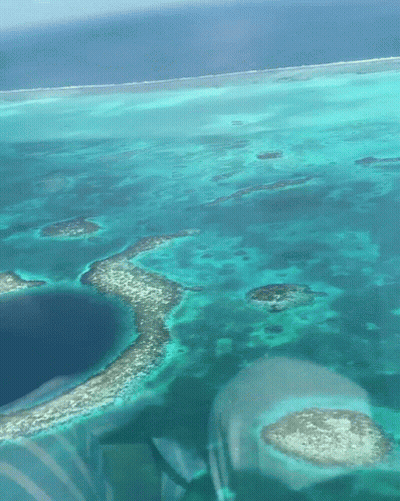 An Aerial View Of A Large Body Of Water With Small Islands GIF