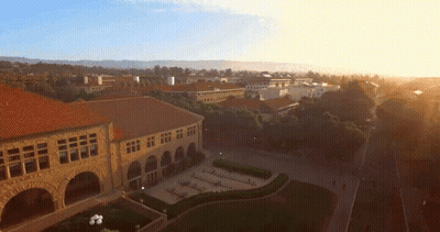 An Aerial View Of A Large Building With Arches GIF