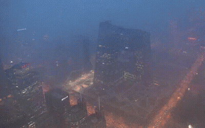 An Aerial View Of A Large City At Night GIF