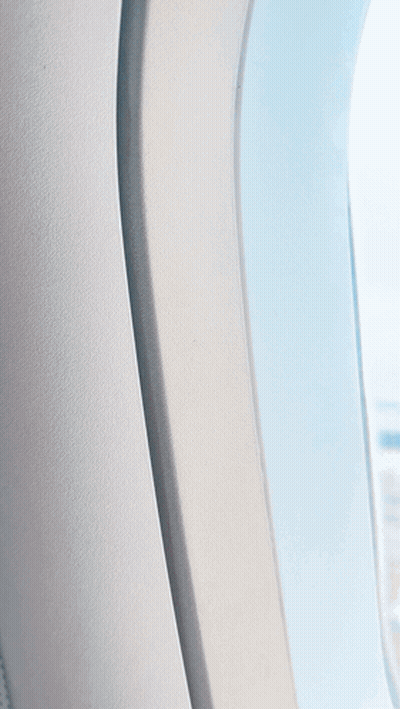 An Aerial View Of A Parking Lot From A Plane Window GIF
