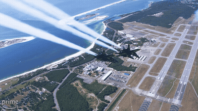 An Aerial View Of A Plane Flying Over A Runway With The Word Prime On The Bottom GIF