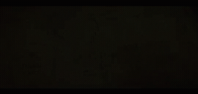 An Aerial View Of A River Surrounded By Mountains And Trees . GIF