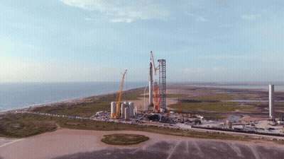 An Aerial View Of A Rocket Being Built On The Beach GIF