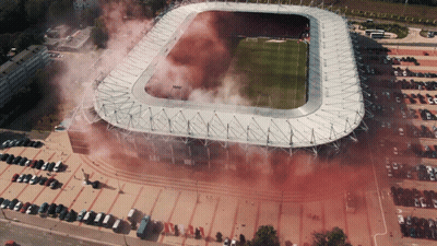 An Aerial View Of A Soccer Stadium With Smoke Coming Out Of It GIF