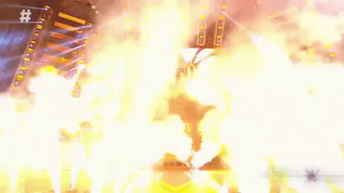 An Aerial View Of A Stadium With A Lot Of Fire And Smoke Coming Out Of It . GIF