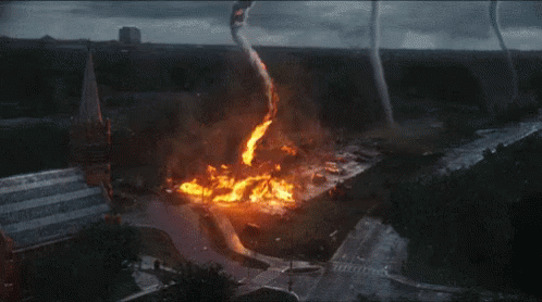 An Aerial View Of A Tornado That Is Coming Down A Hill GIF