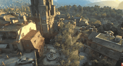 An Aerial View Of A Town With A Fountain In The Middle Of It GIF