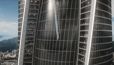 An Aerial View Of A Very Tall Building With A Clock On The Top Of It GIF