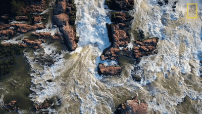 An Aerial View Of A Waterfall With The National Geographic Logo Visible GIF