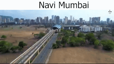 An Aerial View Of Navi Mumbai With A Train Going Through The City GIF