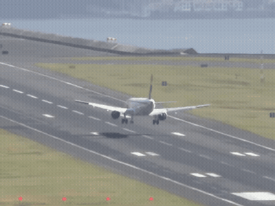 An Airplane Is Taking Off From A Runway With The Number 8 On The Right Side GIF