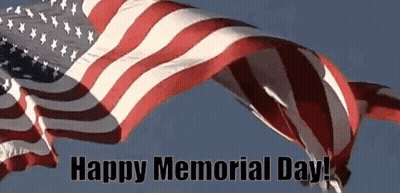An American Flag Is Waving In The Wind With The Words `` Happy Memorial Day '' Below It . GIF