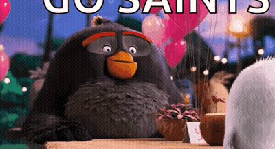 An Angry Bird From The Movie The Angry Birds Is Sitting At A Table With Balloons . GIF