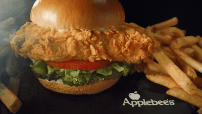 An Applebee 'S Chicken Sandwich With French Fries On The Side GIF