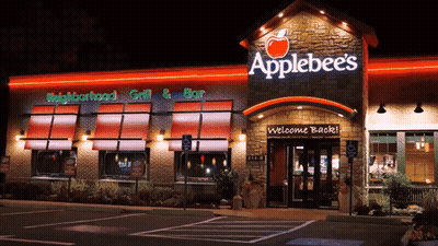 An Applebee 'S Restaurant With A Welcome Back Sign In Front Of It GIF
