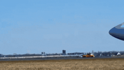 An Atl Airplane Is Taking Off From An Airport Runway GIF