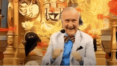 An Elderly Man In A Suit And Tie Is Sitting On A Throne With A Microphone On His Head . GIF