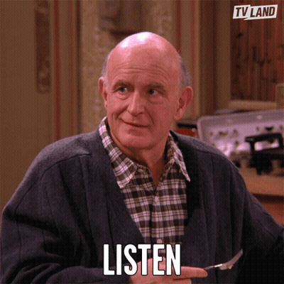 An Elderly Man Is Holding A Fork In His Hand And Says Listen GIF