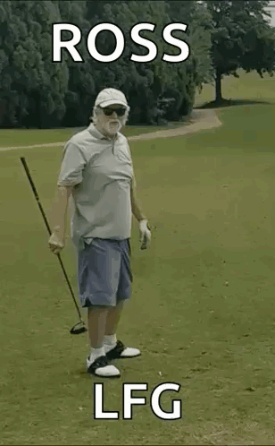 An Elderly Man Is Holding A Golf Club On A Golf Course . GIF