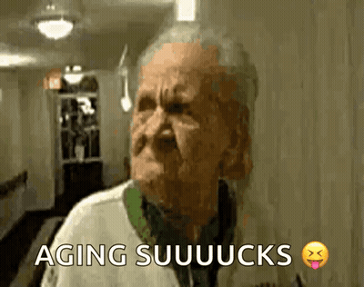 An Elderly Man Is Making A Funny Face And The Words Aging Suuuucks Are Above Him GIF