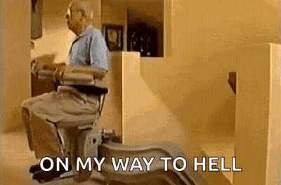 An Elderly Man Is Sitting In A Wheelchair With The Words `` On My Way To Hell '' Written On The Bottom . GIF