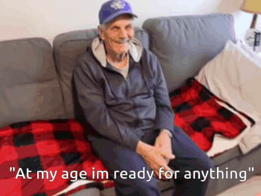 An Elderly Man Is Sitting On A Couch With The Words " At My Age Im Ready For Anything " GIF