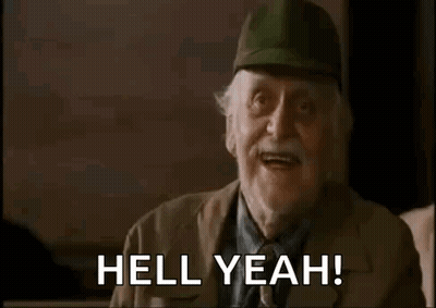 An Elderly Man Wearing A Baseball Cap Is Making A Funny Face And Saying `` Hell Yeah '' . GIF